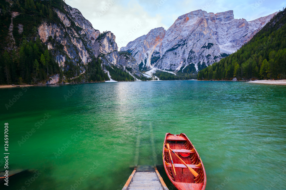 Boats on the Braies Lake ( Pragser Wildsee ) in Dolomites mounta