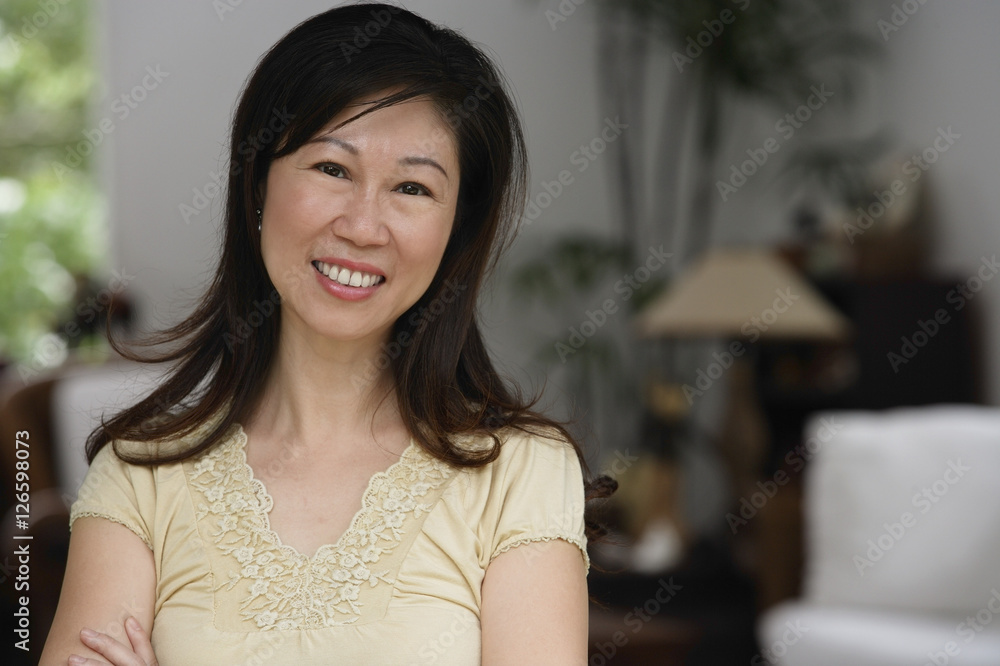 Woman at home, smiling at camera, head shot Woman at home, smiling at camera, head shot