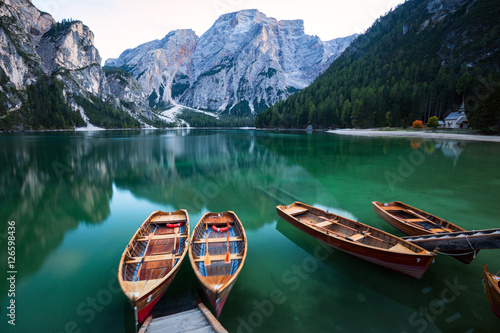 Boats on the Braies Lake ( Pragser Wildsee ) in Dolomites mounta photo