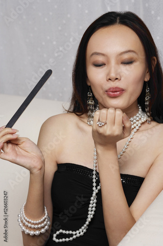 Young woman holding nail file