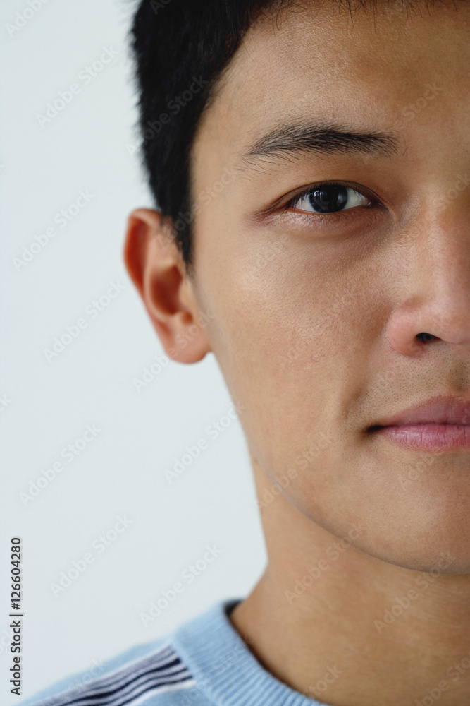 Fototapeta premium A close-up of a man looking at a camera