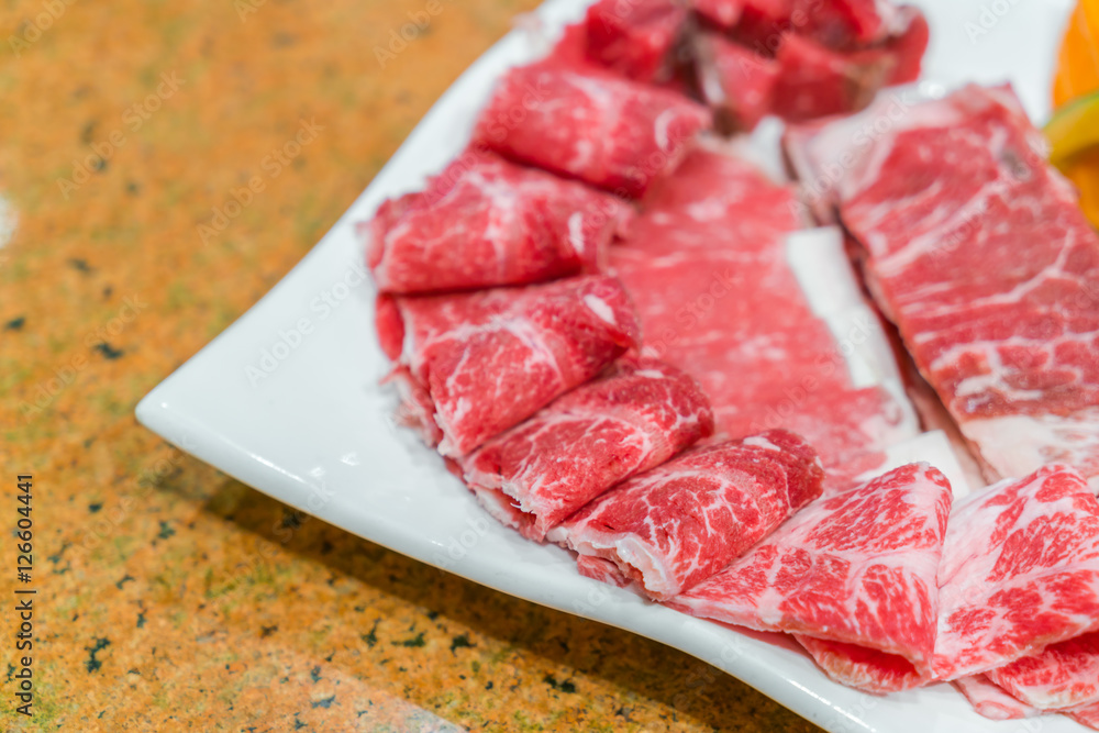 Uncooked raw fresh beef .