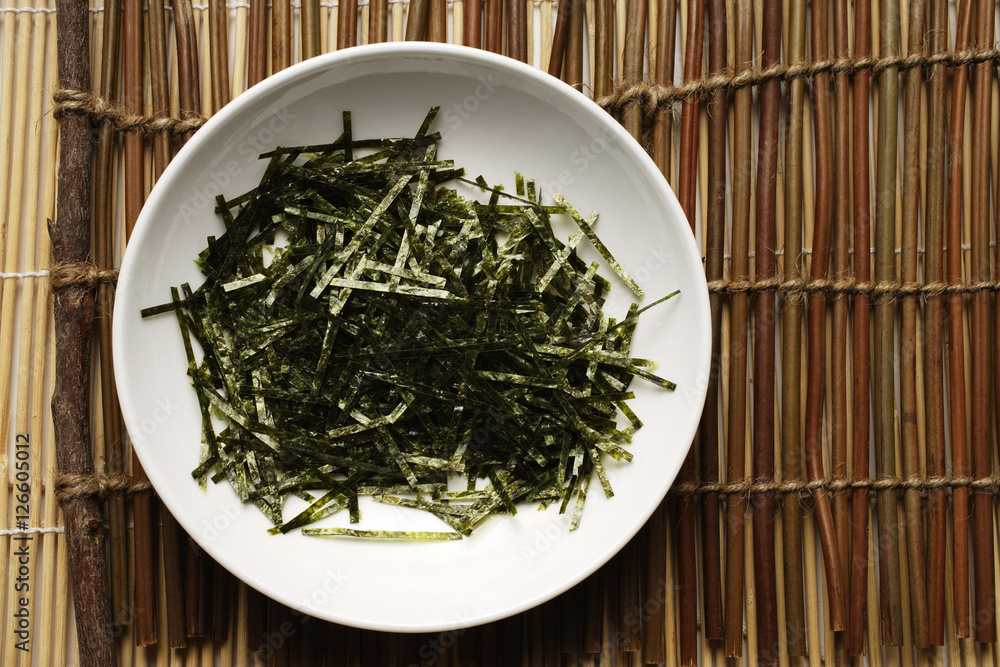 seaweed shreds in a white bowl