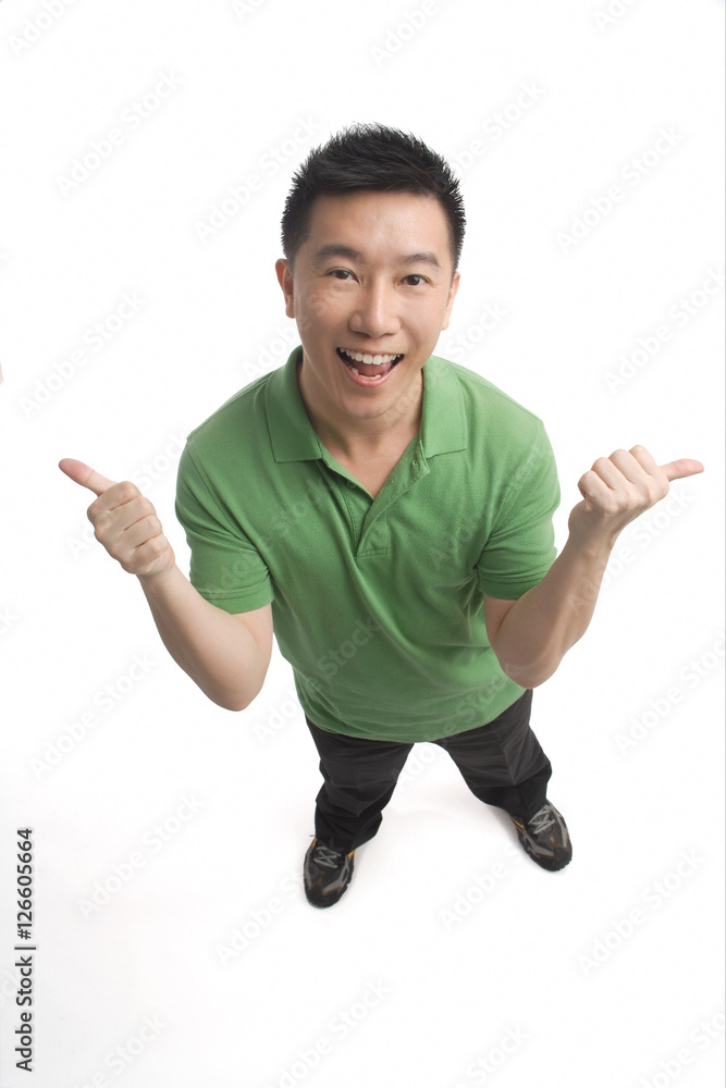 Man smiling at camera and giving two thumbs up