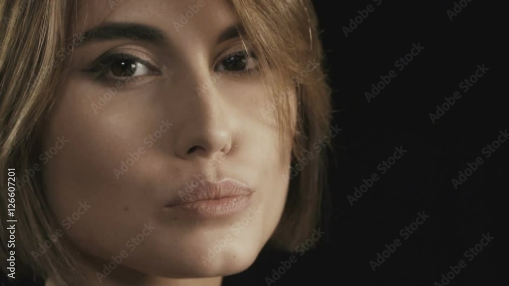 Playful seductive brunette woman with short haircut looking at camera and looking away Playful seductive brunette woman with short haircut looking at camera and looking away