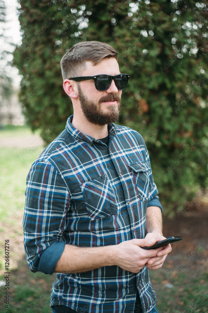 Man with gadget and glasses Man with gadget and glasses