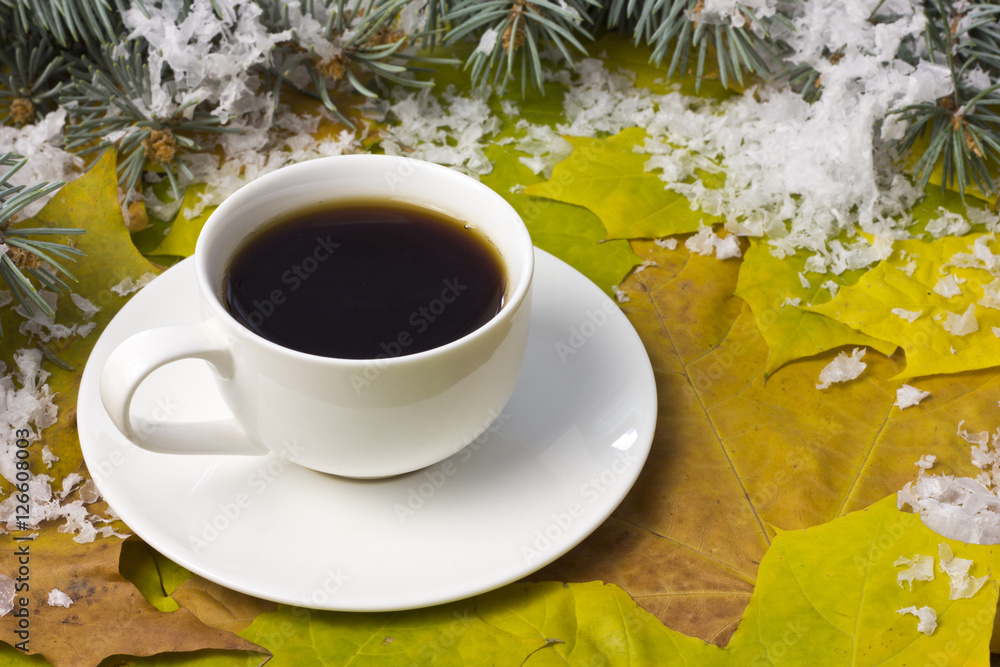 Coffee in a white mug and snow Coffee in a white mug and snow