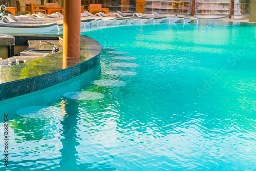Swimming pool bar in tropical Maldives island .