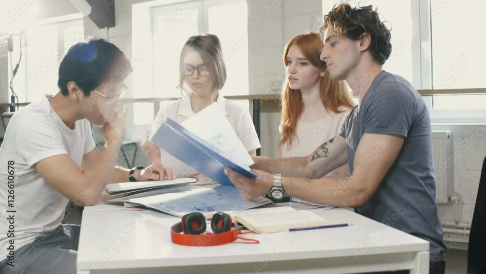 Young businesspeople having an argue while sitting at the meeting Young businesspeople having an argue while sitting at the meeting