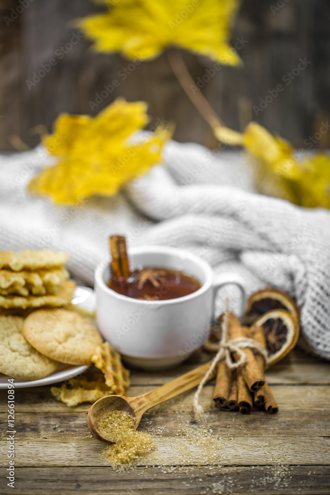 Fototapeta premium delicious cookies and Cup of hot tea with a cinnamon stick