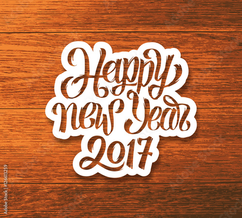 Happy New Year 2017 greeting card design. Sticker with hand lettering inscription on wood background. Vector festive ilustration with typography.