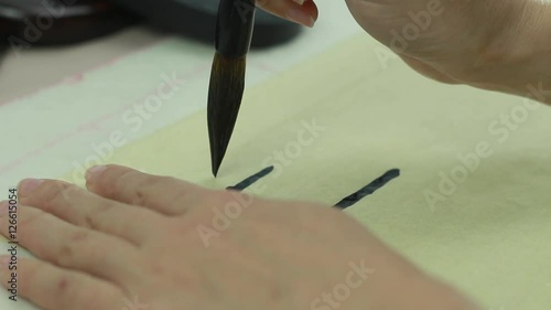 Draw a Line on the Vintage Paper. Learning to Write Characters Using a Brush For Calligraphy 2