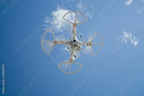 Drone in flight over the blue sky