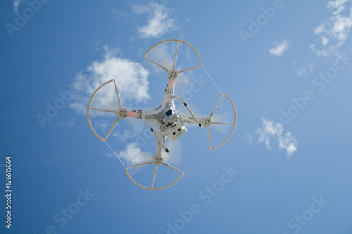 Drone in flight over the blue sky