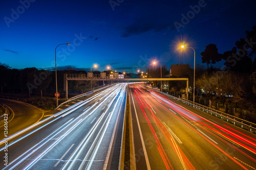 Speed Traffic - light trails on motorway highway at night, long exposure abstract urban background © andrii_lutsyk