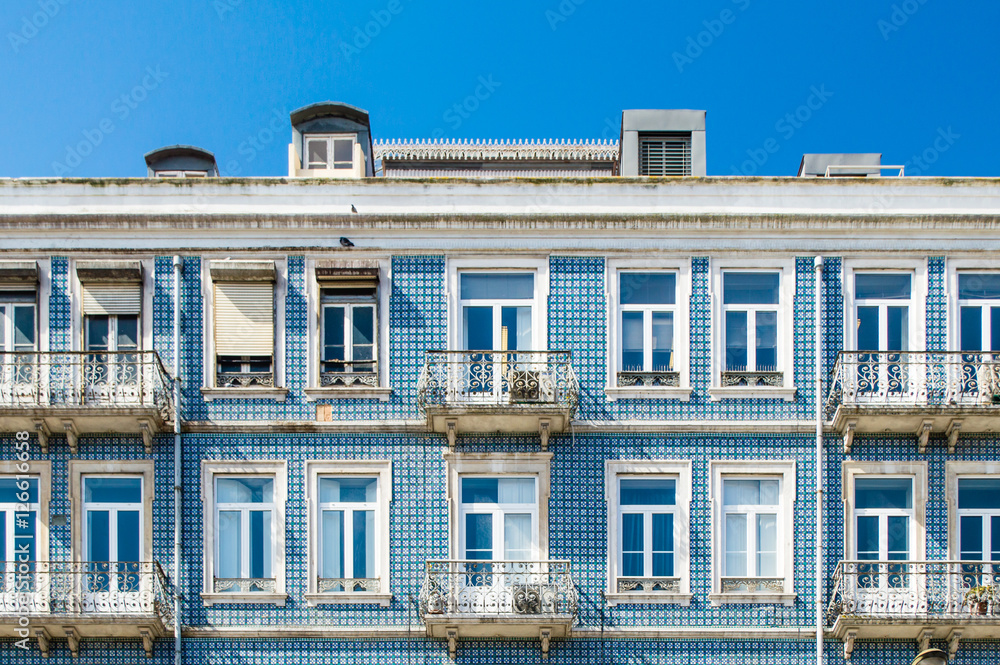 Lisbon buildings with typical traditional portuguese tiles on the wall in Lisbon, Portugal