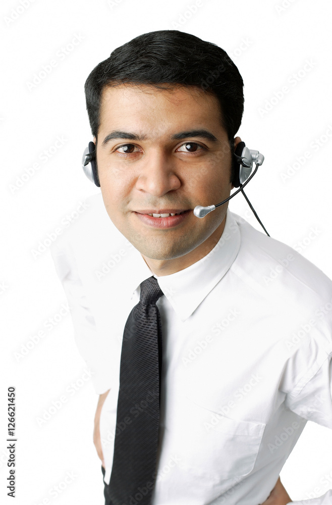 Executive wearing headset, looking at camera Executive wearing headset, looking at camera