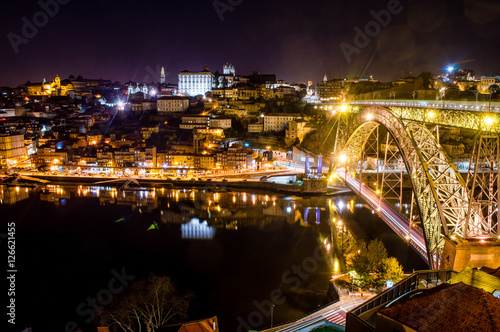Porto evening skyline cityscape with Douro River and Dom Luis I Bridge in Porto, Portugal