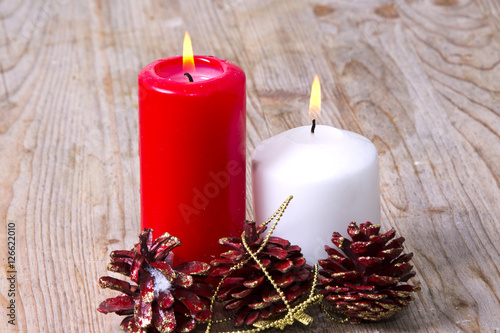 Candles lit with Christmas decorations