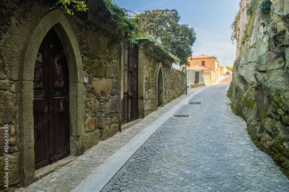 Old street with stone walls in Porto, Portugal