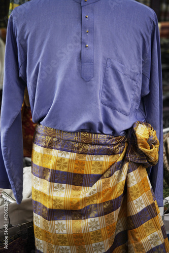 Closeup of baju melayu, traditional Malay attire for men.