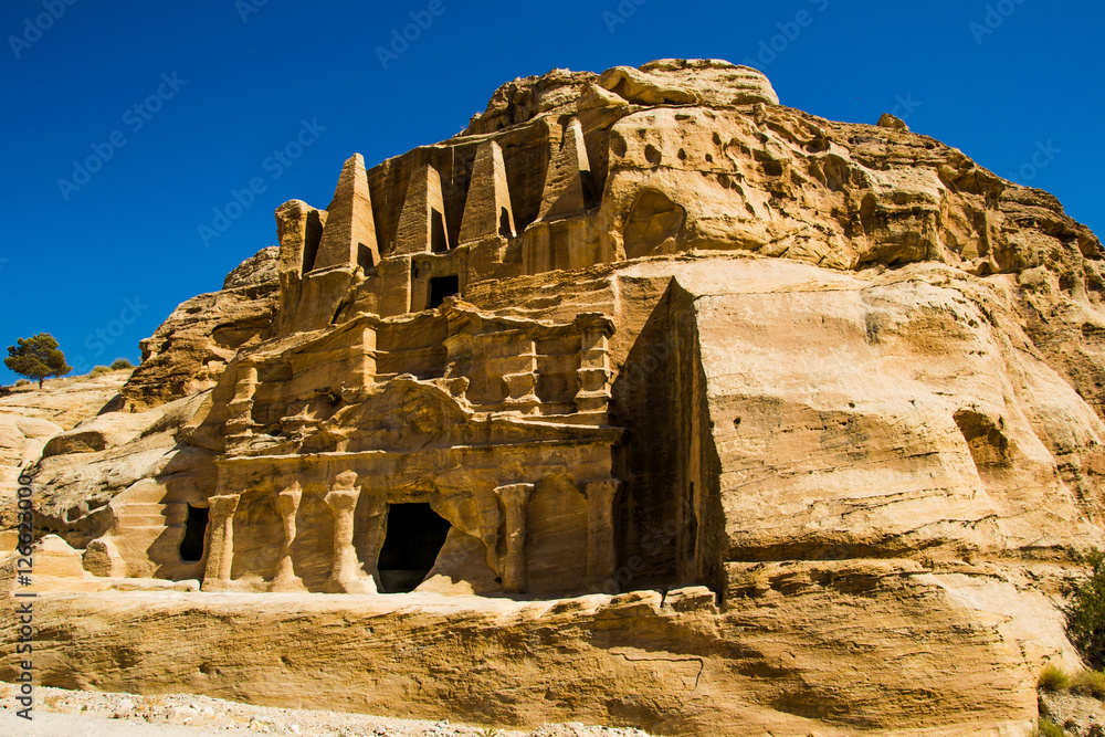 Obelisk Tomb and Bab As-Siq Triclinium ruins ancient Nabataean city Petra,  Jordan near entrance to canyon Siq. Explore and adventure concept. Stock  Photo | Adobe Stock