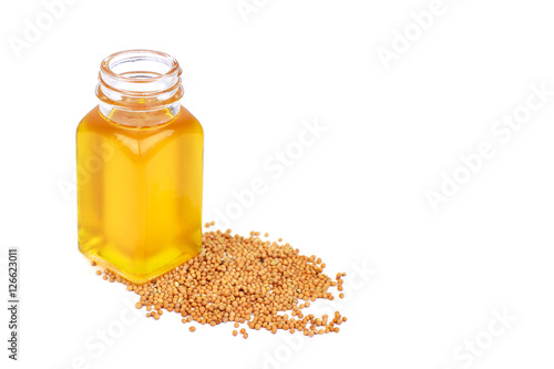 Mustard oil in bottle and seeds mustard