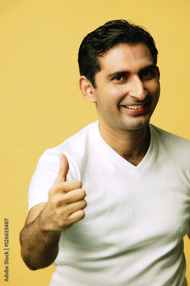 Man smiling at camera, making Man smiling at camera, making
