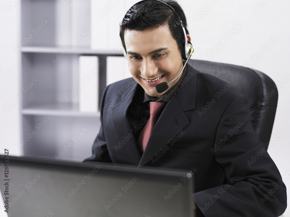 man using earphones and talking through microphone man using earphones and talking through microphone