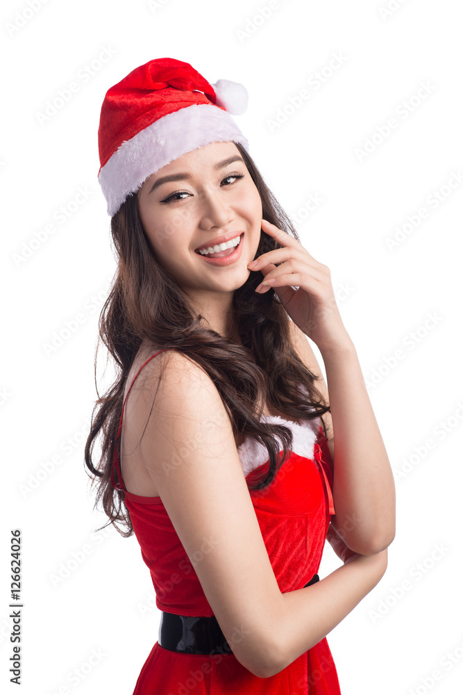 Christmas Woman. Beauty Asian Model Girl in Santa Hat isolated o Christmas Woman. Beauty Asian Model Girl in Santa Hat isolated o