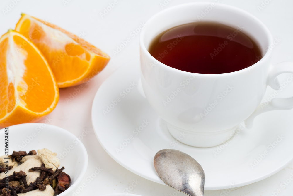 a mug of tea and ginger with berries a mug of tea and ginger with berries