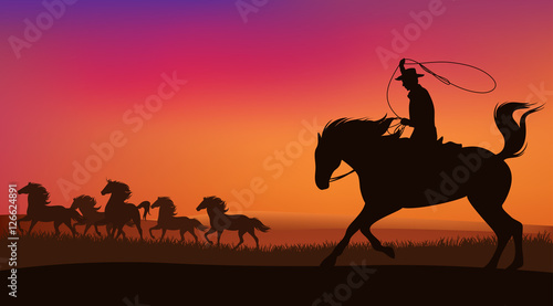 wild west sunset scene with horses and cowboy