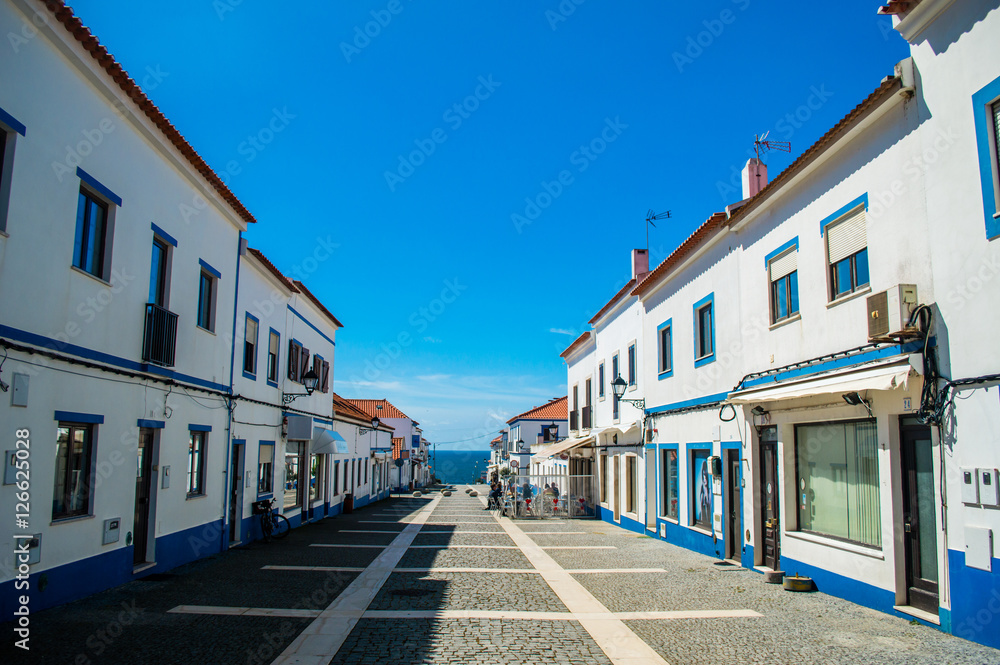 Traditional blue and white Alentejo Portuguese buildings in Porto Covo, Portugal