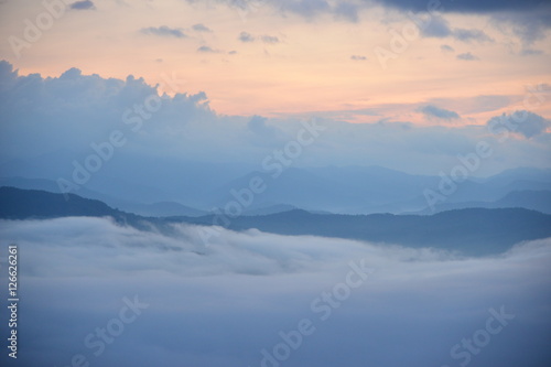 Landscape Mountain and mist in the morning at Doi Pha Chu in Si Nan National Park, Nan Province, Thailand © jejejune