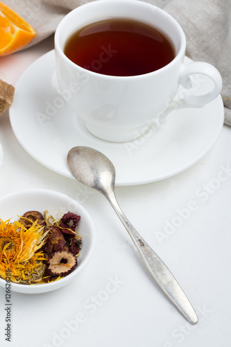a mug of tea, berries and spices