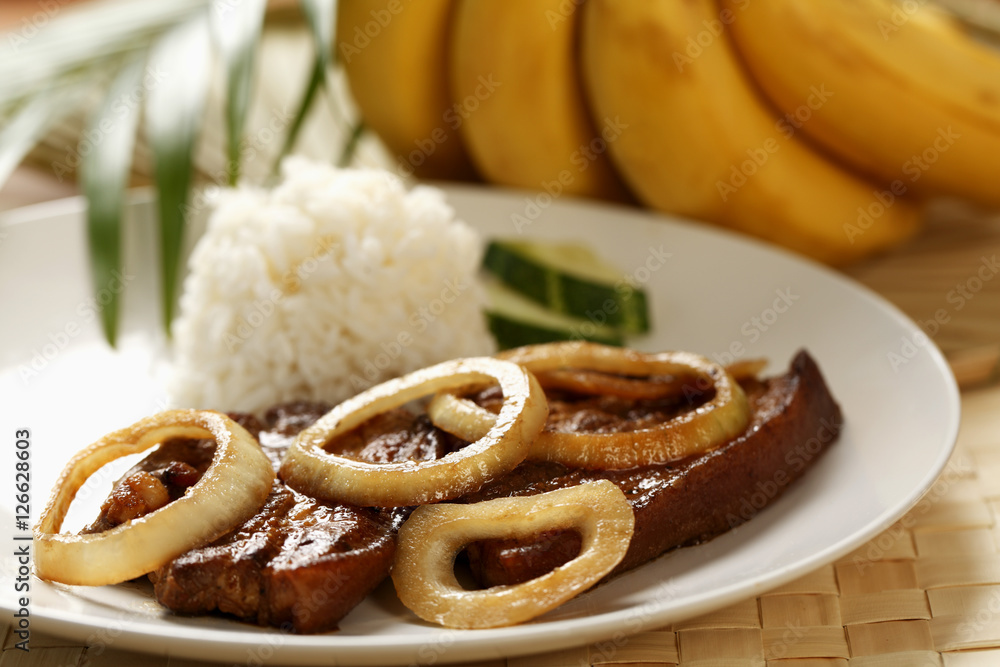 Pork steak with rice (Bistik Tagalog). Traditional Filipino dish