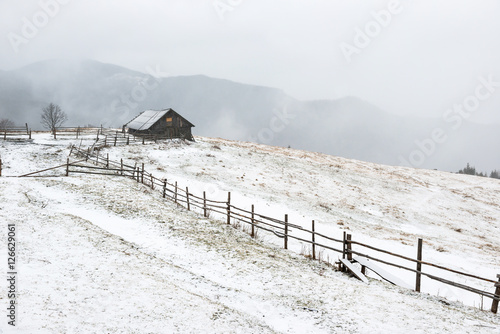 House in white winter mountains