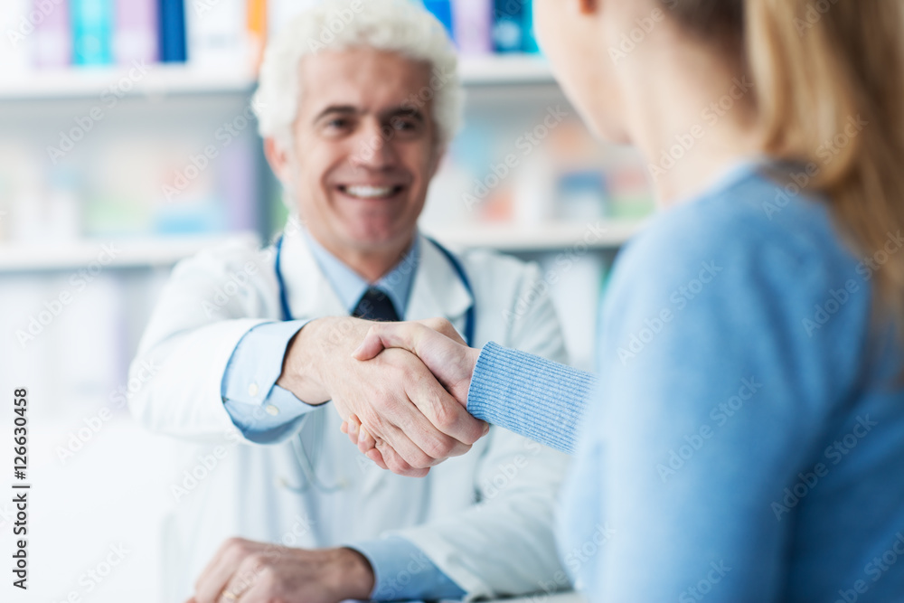 Doctor and patient shaking hands
