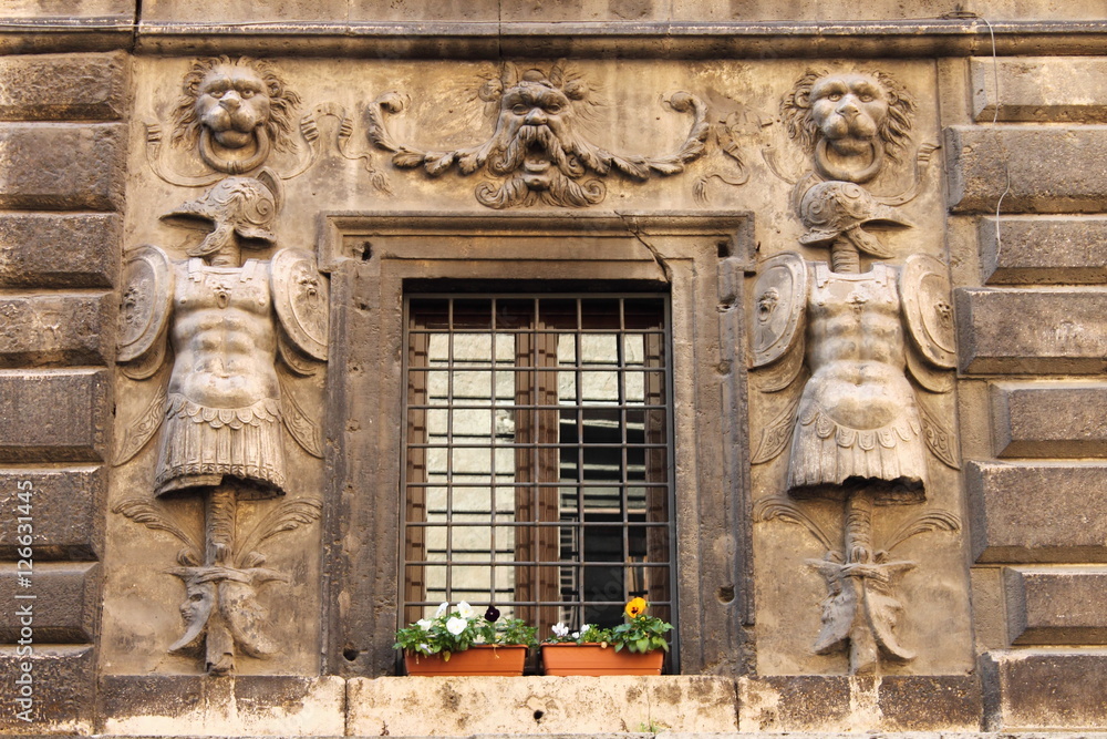 Renaissance window with flower pots