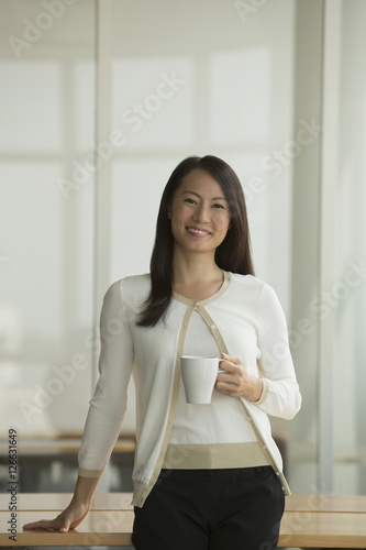 Free Download Singapore, Portrait of business woman in office - GFXLoad