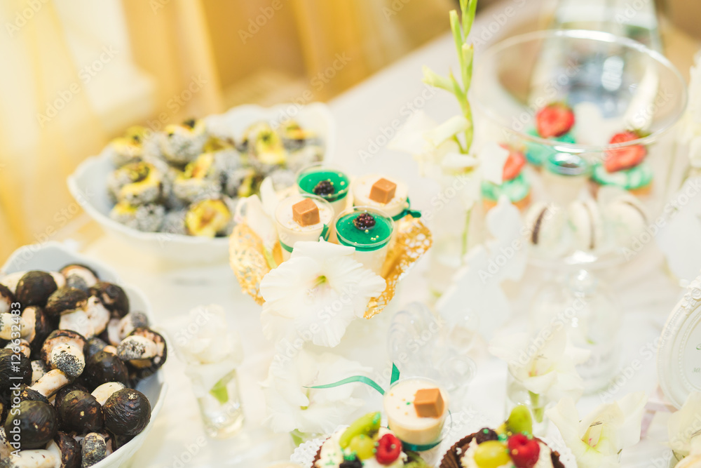 Delicious wedding reception candy bar dessert table Delicious wedding reception candy bar dessert table