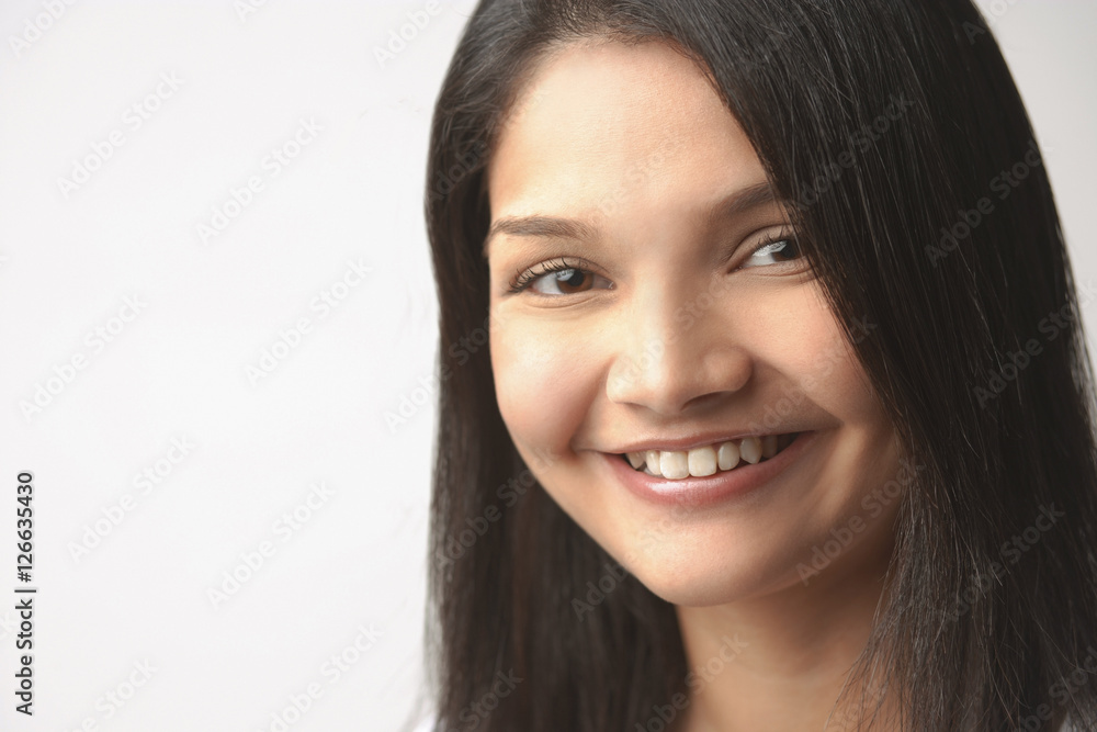 Woman looking at camera, smiling, head shot Woman looking at camera, smiling, head shot