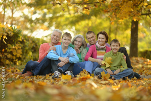 Family relaxing in autumn park © aletia2011
