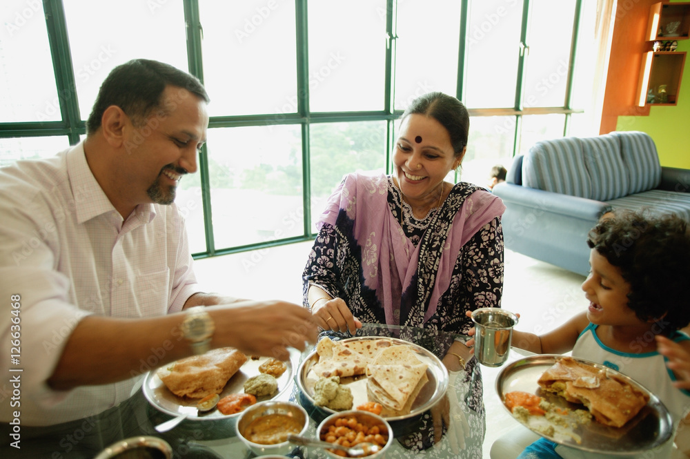 Family of three having a meal at home