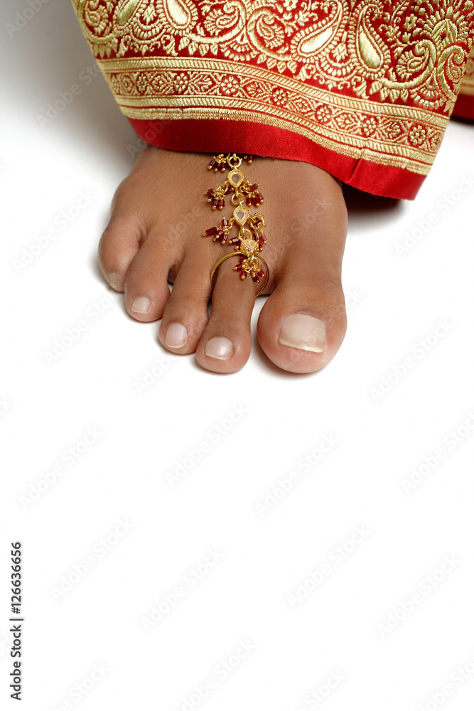 Close-up of woman's feet with toe ring