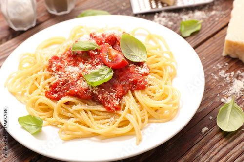 spaghetti with tomato sauce and parmesan