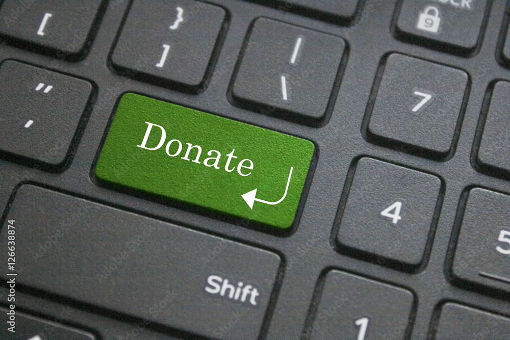 Close up of donate button on computer keyboard Close up of donate button on computer keyboard