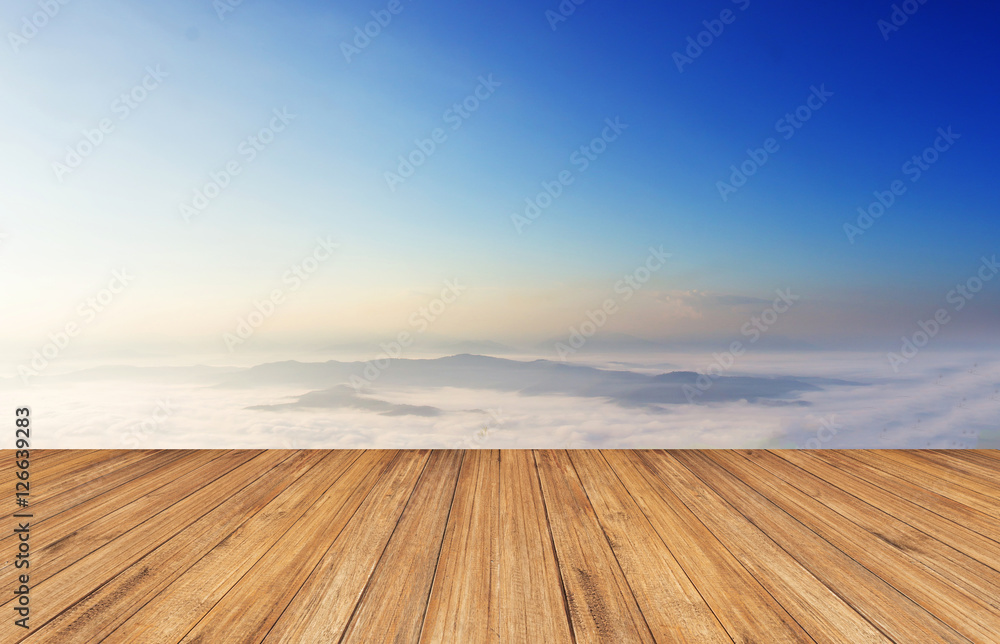 Wood floor against Foggy above the mountain