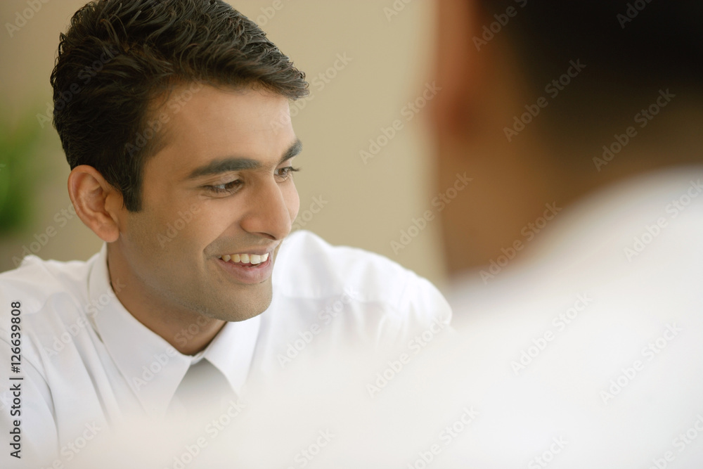 Businessman smiling, looking away Businessman smiling, looking away