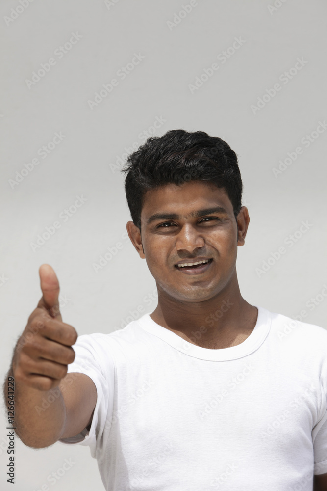 Man with thumbs up smiling Man with thumbs up smiling